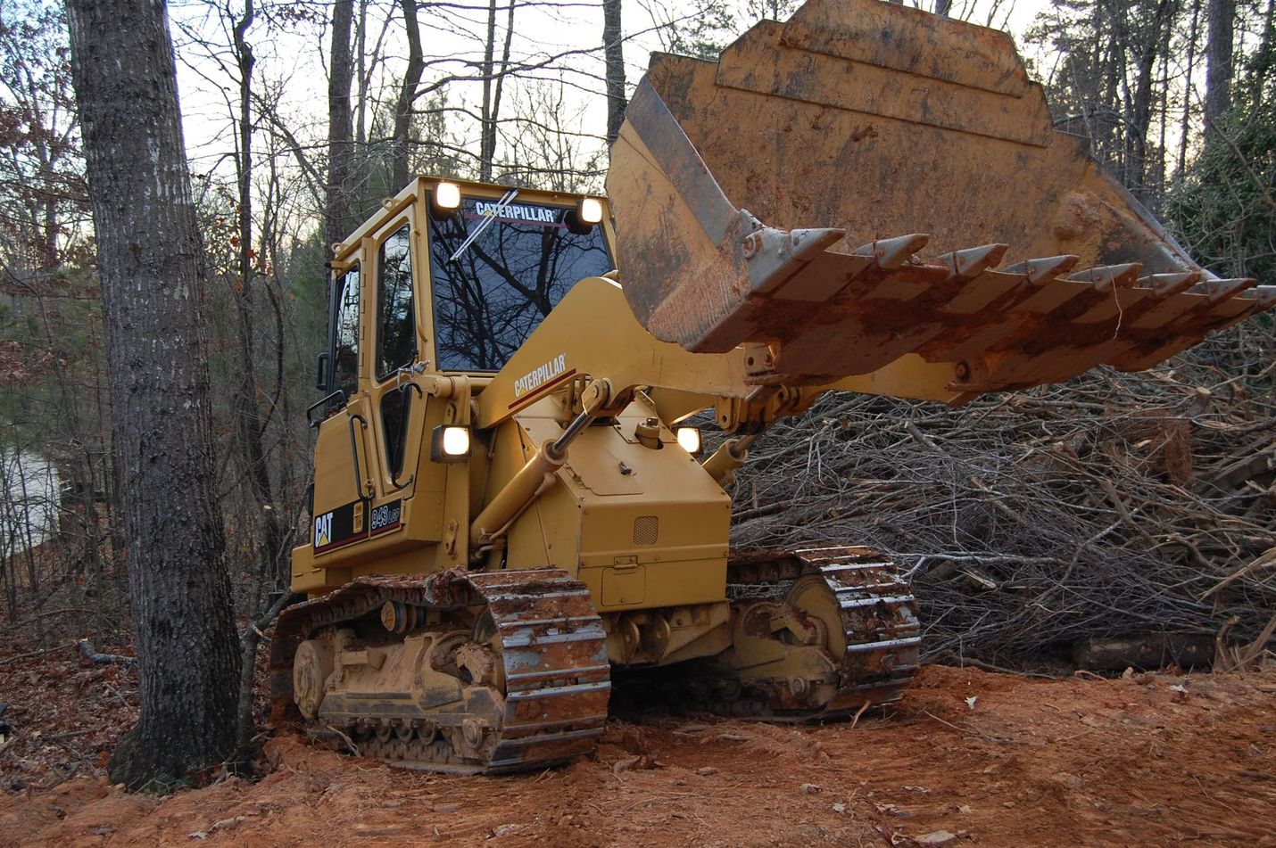 Caterpillar Track Type Loader working a cleared lot in North Georgia