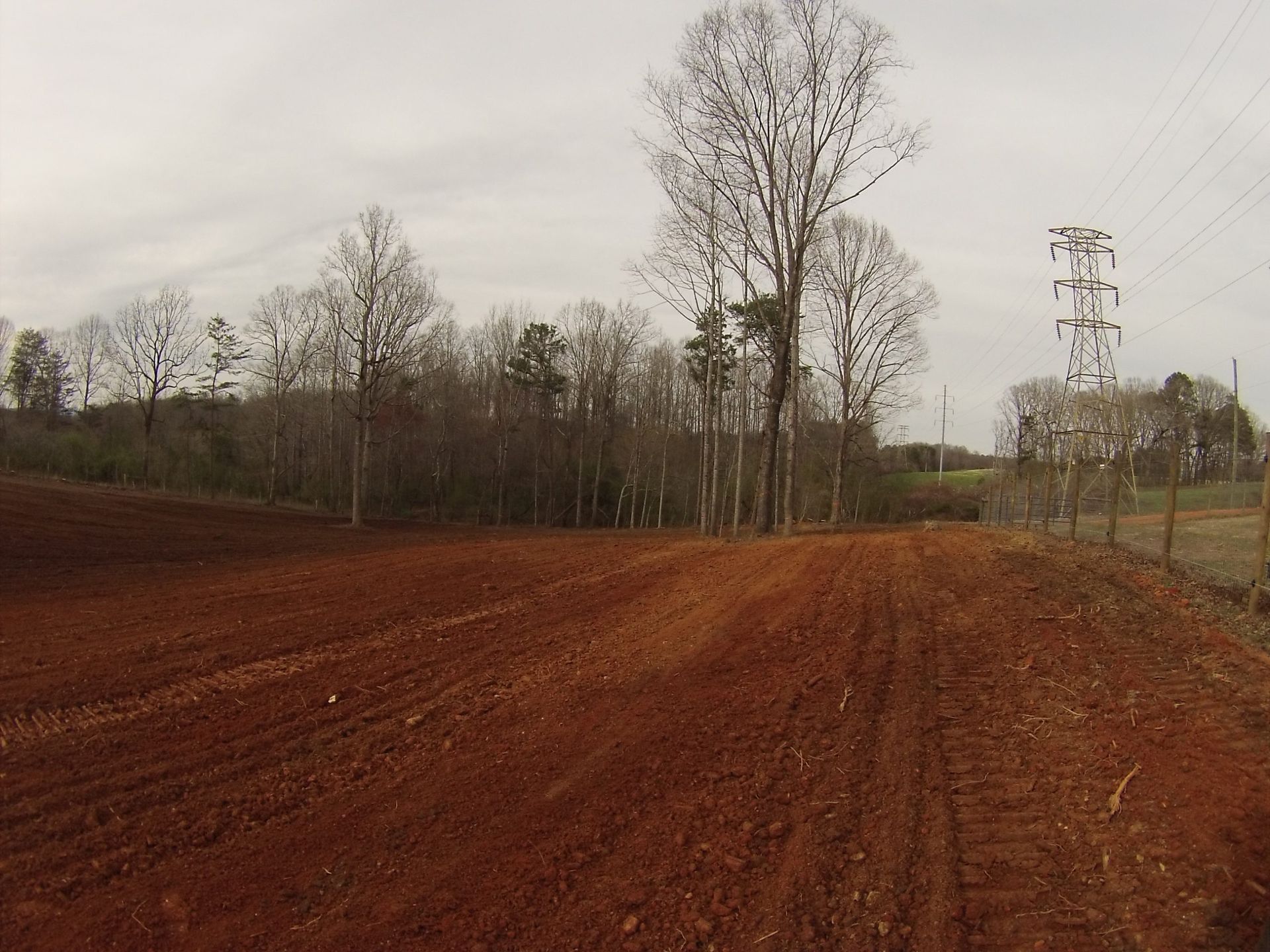 Heavy equipment grading steep mountain terrain in Pickens County, Georgia