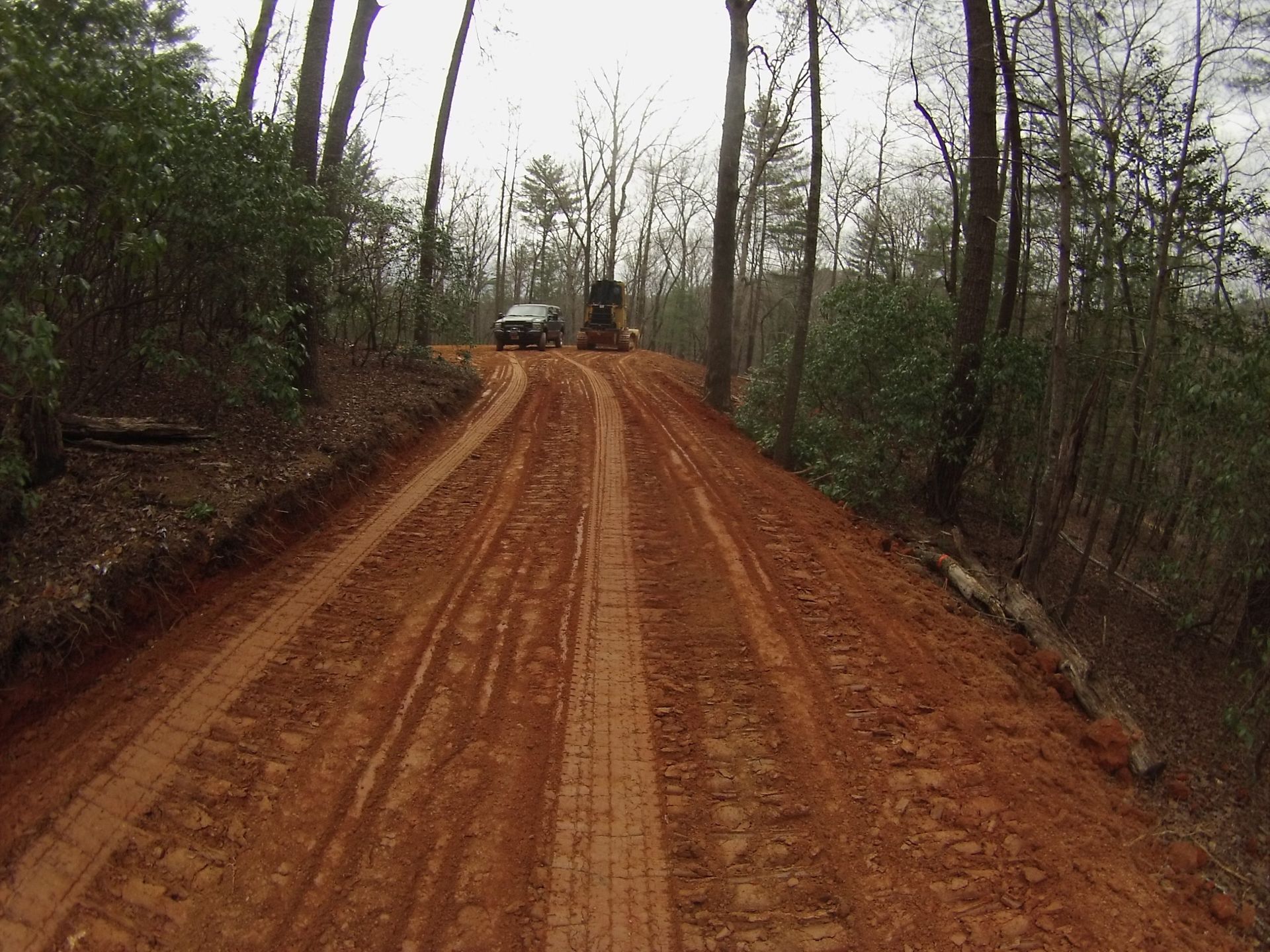 Heavy equipment grading steep mountain terrain in North Georgia
