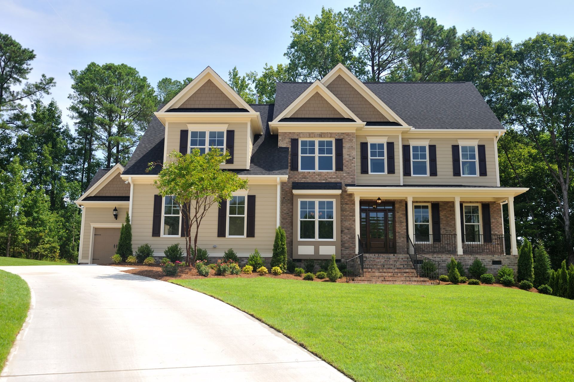 brown house and curved driveway
