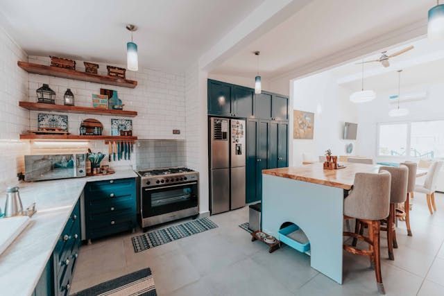 kitchen with white counter blue cabinets and open shelving