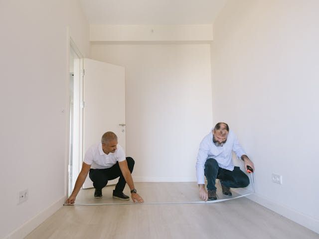  people+measuring+a+hallway