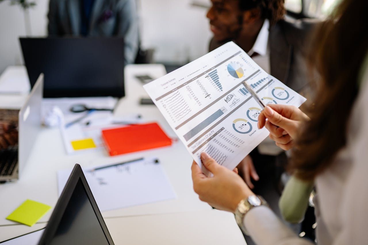 person holding a spreadsheet