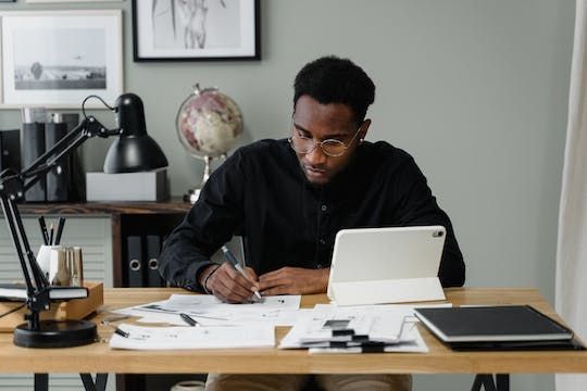 property manager looking over a document at their desk