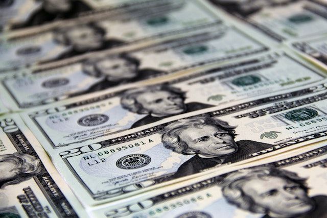twenty dollar bills on a table