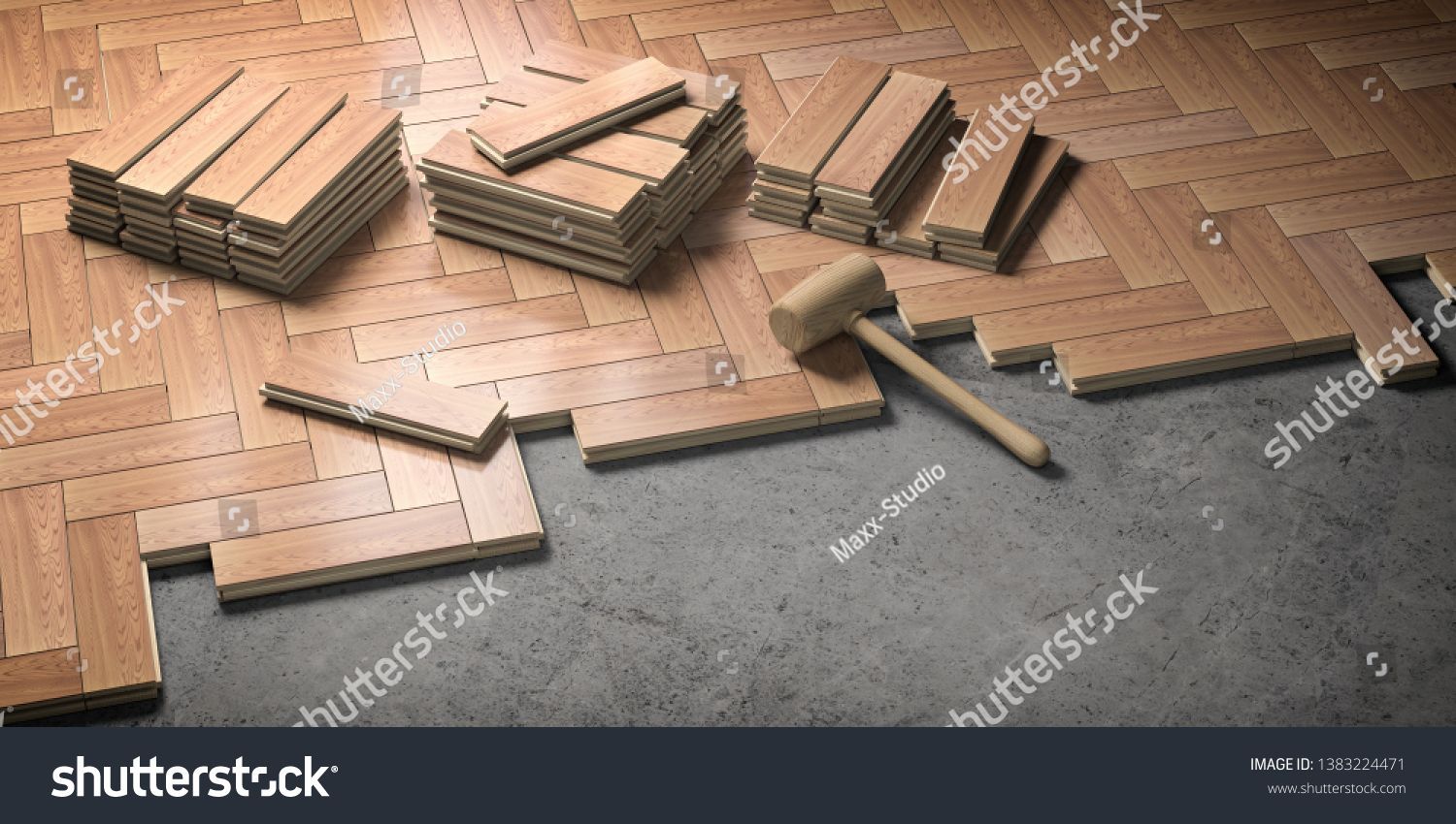 Laminate flooring being installed, with planks, hammer, and tools on a partially covered floor