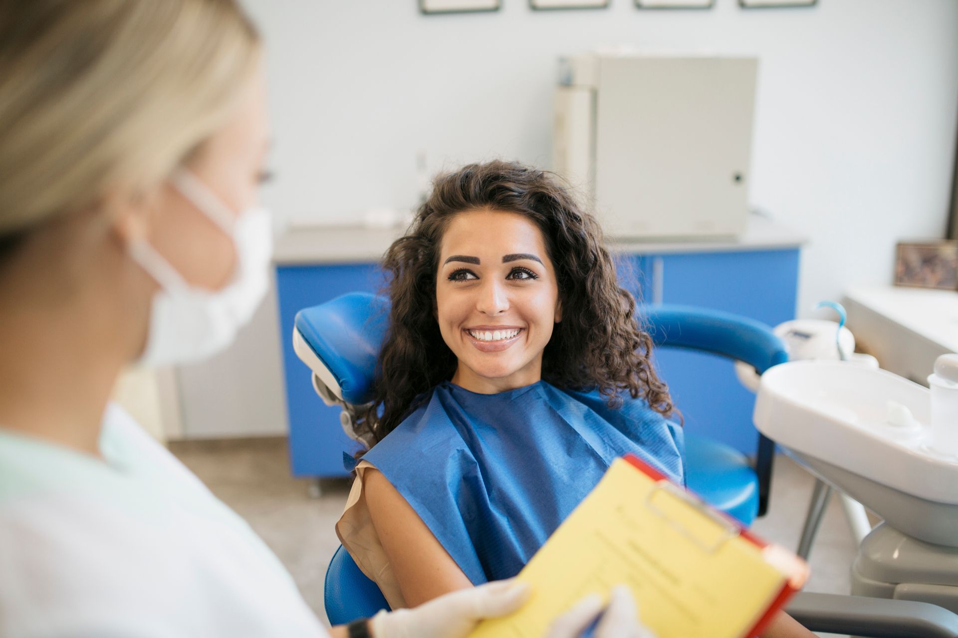 A man is getting his teeth examined by a dentist.
