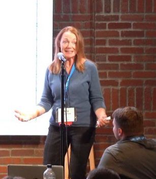 Amy Hooper Hanna addressing an audience during a keynote