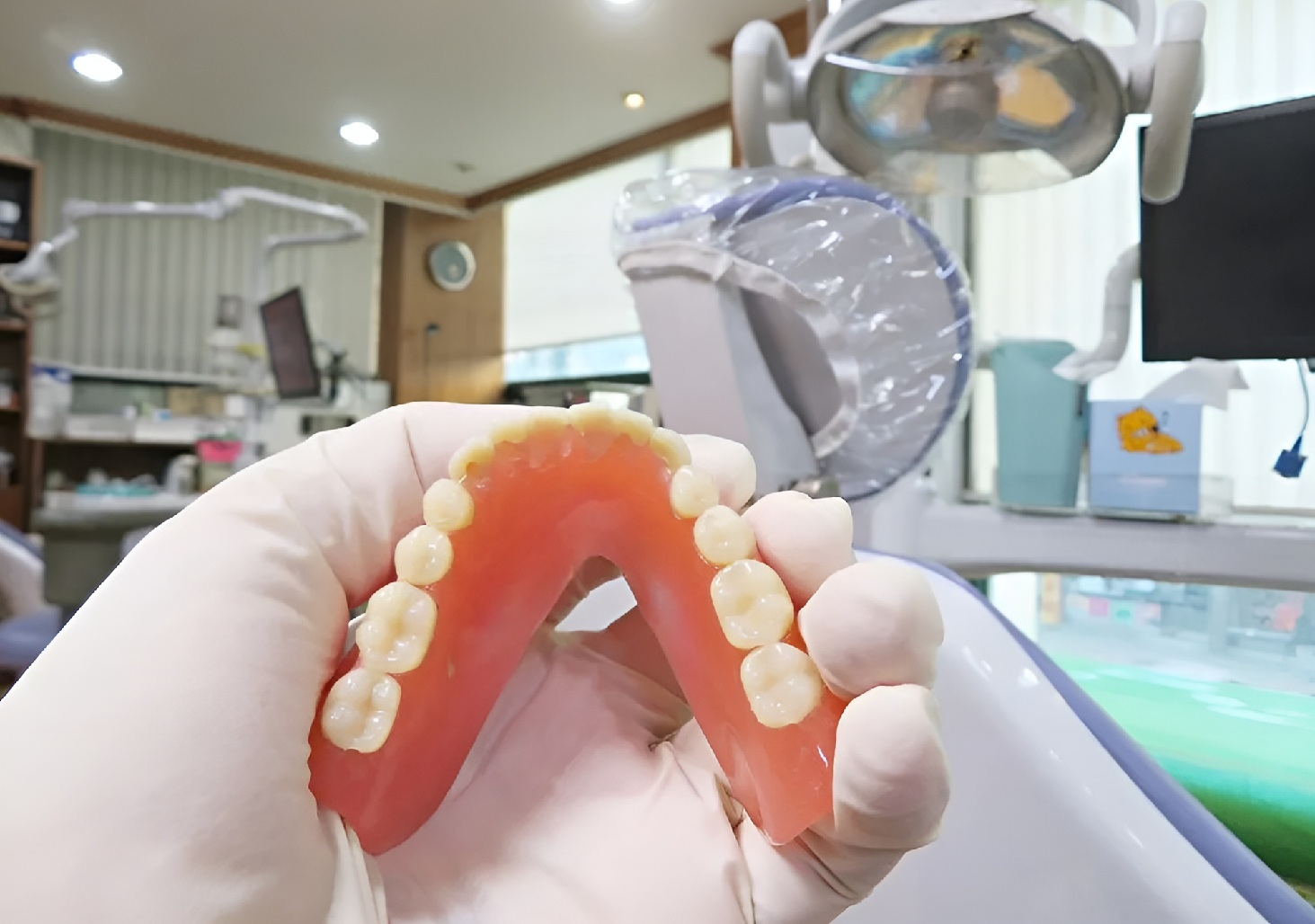 Dentures Held In Dental Clinic Examination Room