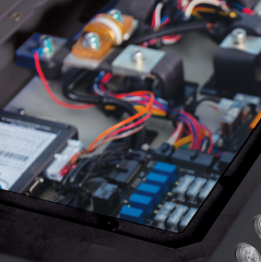 A close up of the inside of a device with a lot of wires