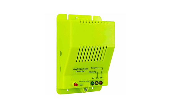 A yellow electronic device is sitting on a white surface.