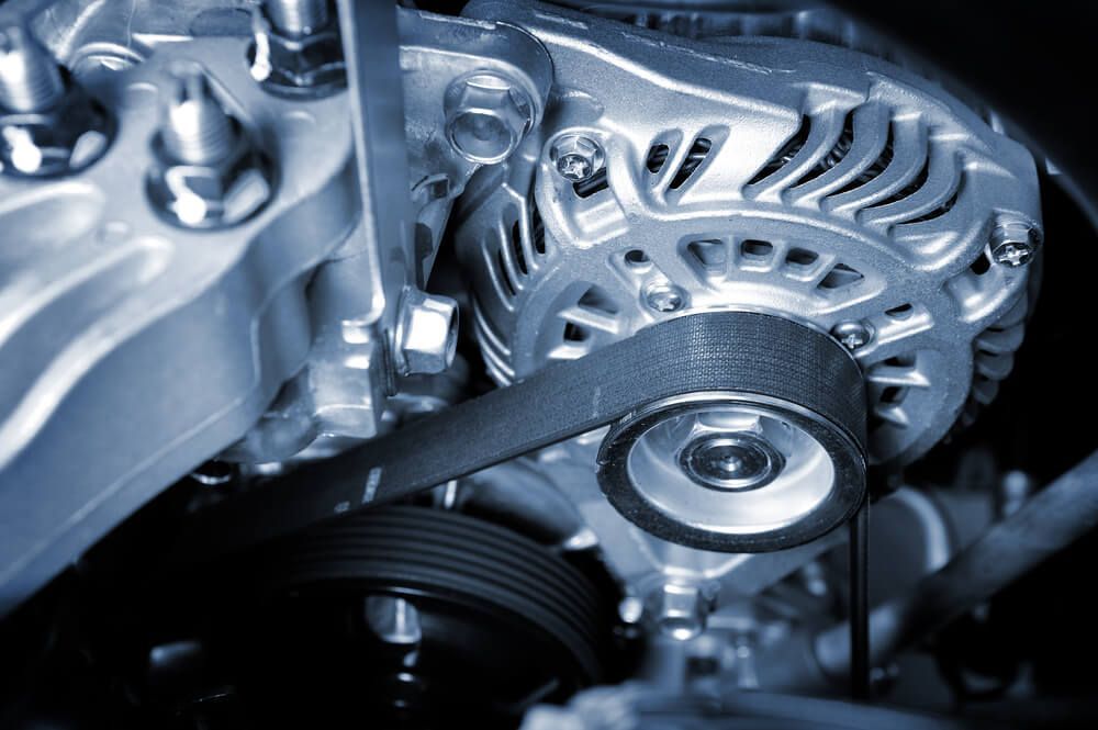 A Close Up of a Car Engine With a Belt on It — Reliable Bus and Truck Repairs In Caloundra West, QLD