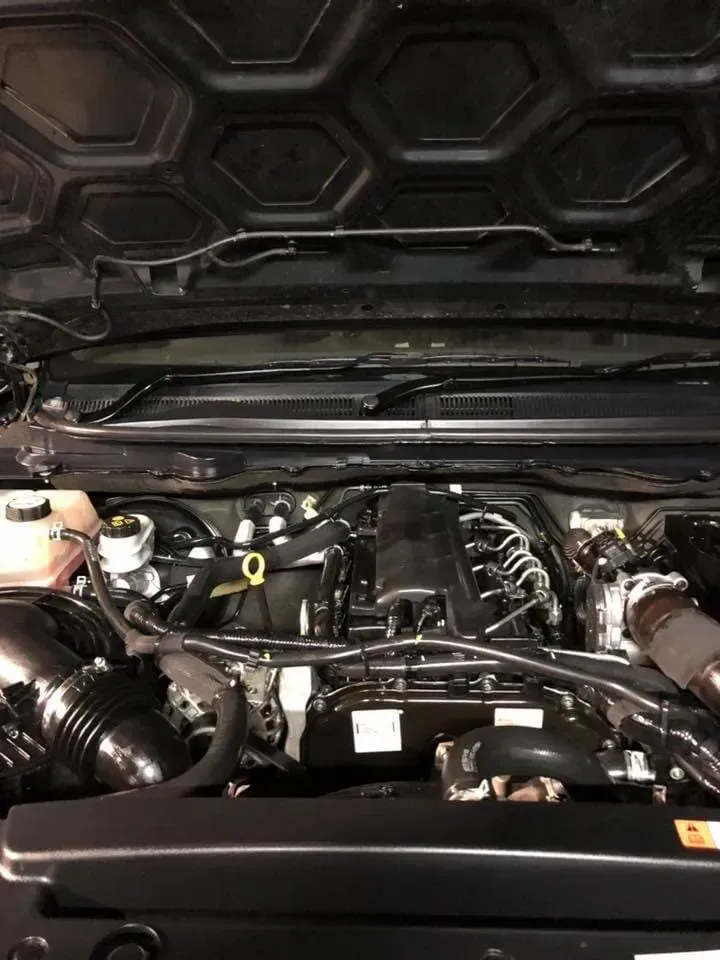 A Close Up of a Car Engine With the Hood Open — Reliable Bus and Truck Repairs In Caloundra West, QLD