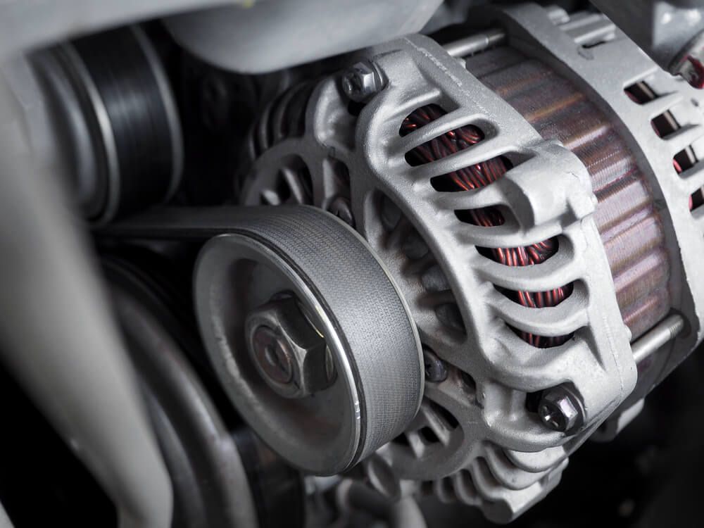 A Close Up of an Alternator on a Car Engine — Reliable Bus and Truck Repairs In Caloundra West, QLD