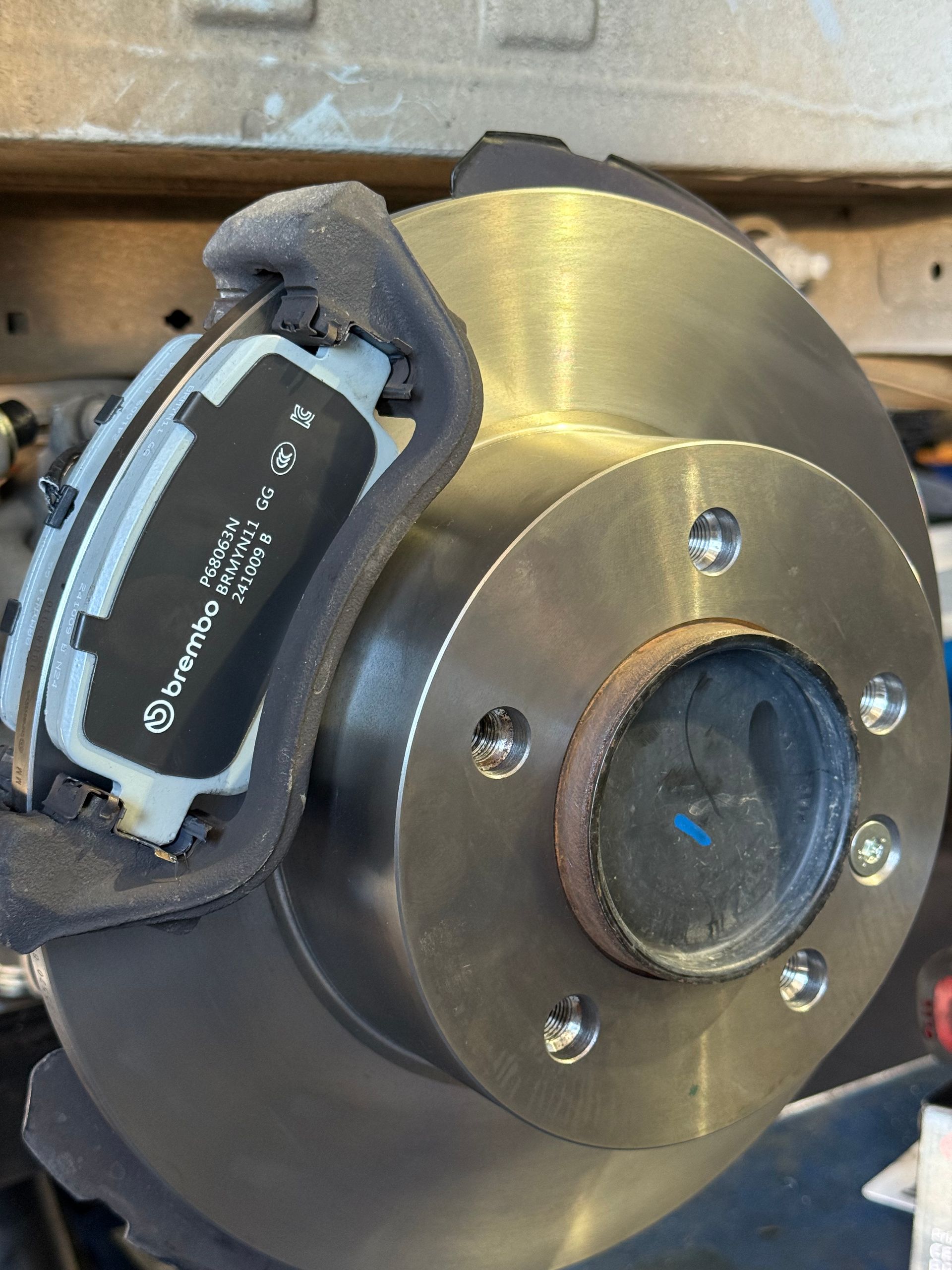 Close-up Of a Car Brake Rotor and Caliper — Reliable Bus and Truck Repairs In Caloundra West, QLD