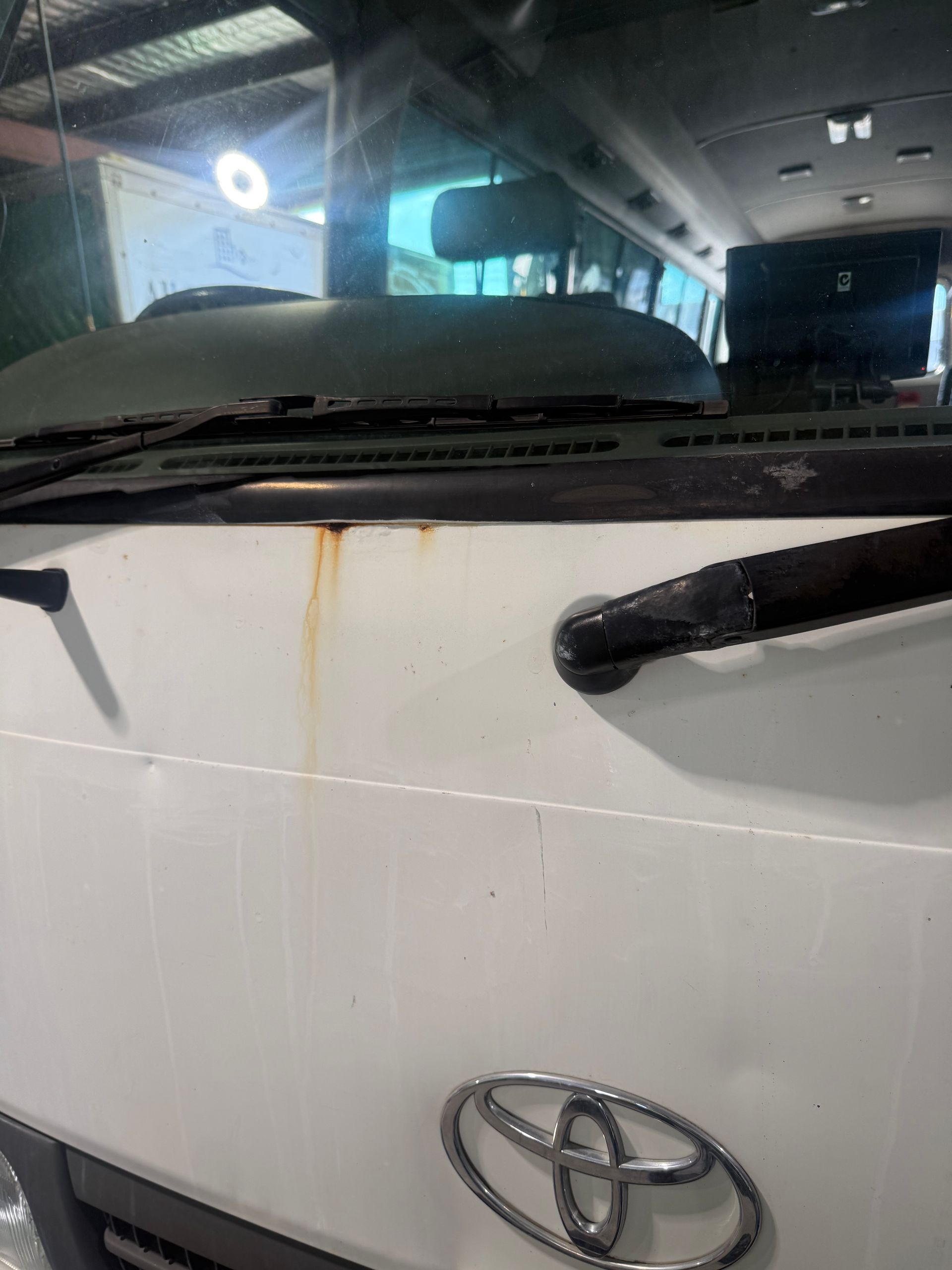 White Toyota Front in a Garage — Reliable Bus and Truck Repairs In Caloundra West, QLD