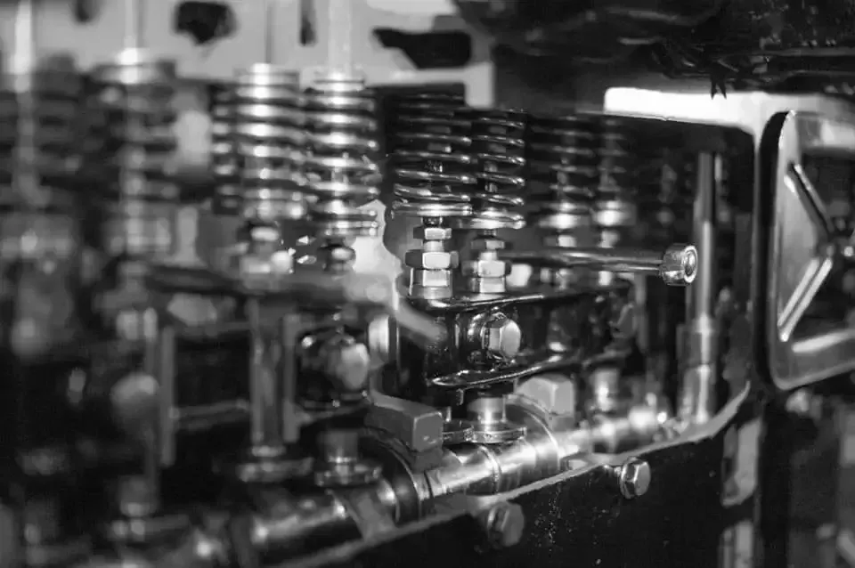 A Black and White Photo of the Inside of a Car Engine — Reliable Bus and Truck Repairs In Caloundra West, QLD