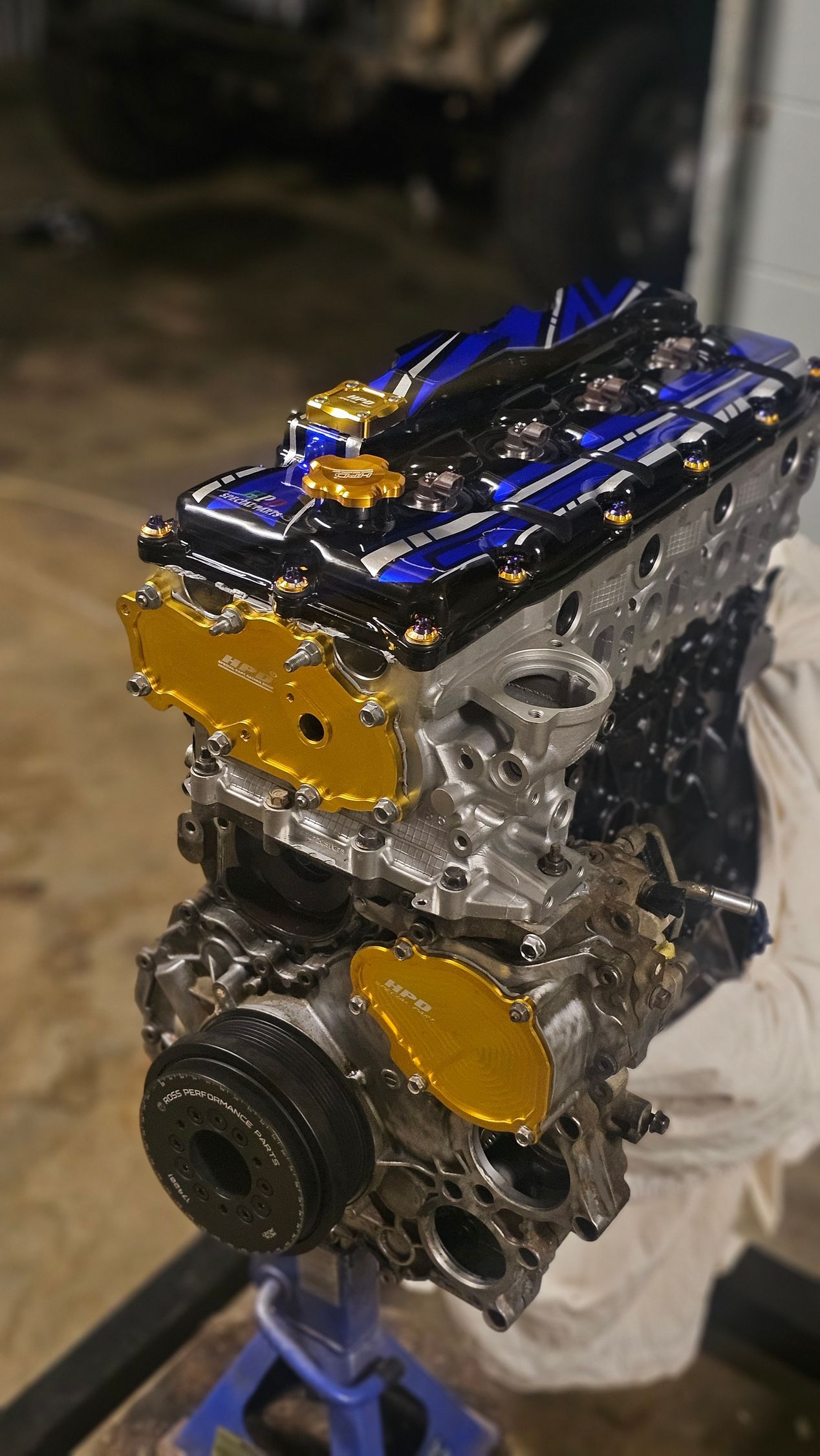 Blue and Gold Engine Block on a Stand, Possibly Modified for Automotive Use — Track N Back 4x4 In Mareeba, QLD