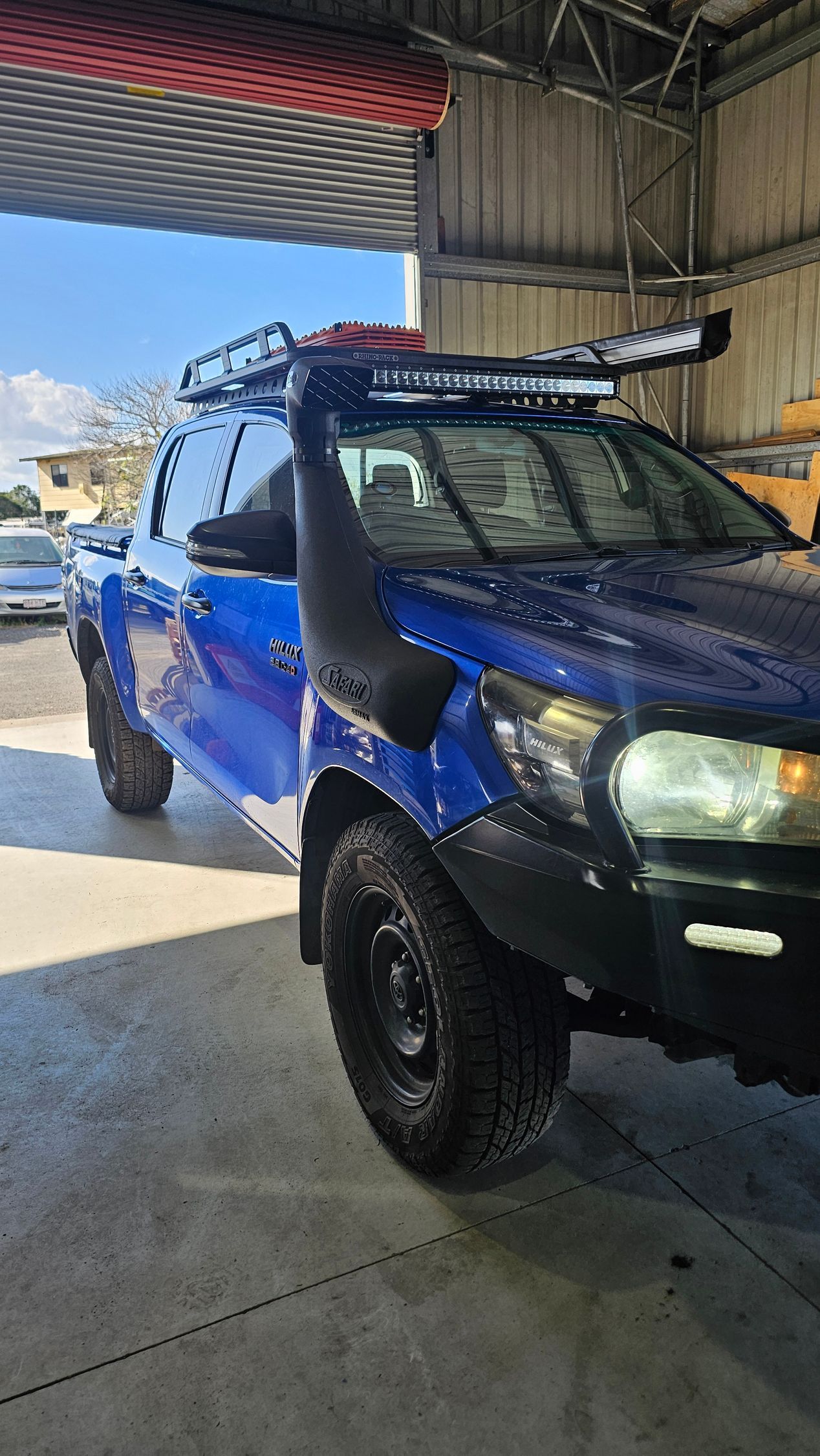 Blue off-Road Pickup Truck With a Snorkel, Roof Rack, and Black Wheels — Track N Back 4x4 In Mareeba, QLD