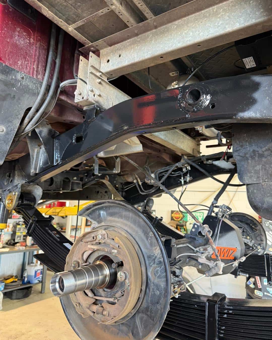 Underside of a Red Pickup Truck, Showing the Rear Axle, Suspension, and Undercarriage — Track N Back 4x4 In Weipa, QLD