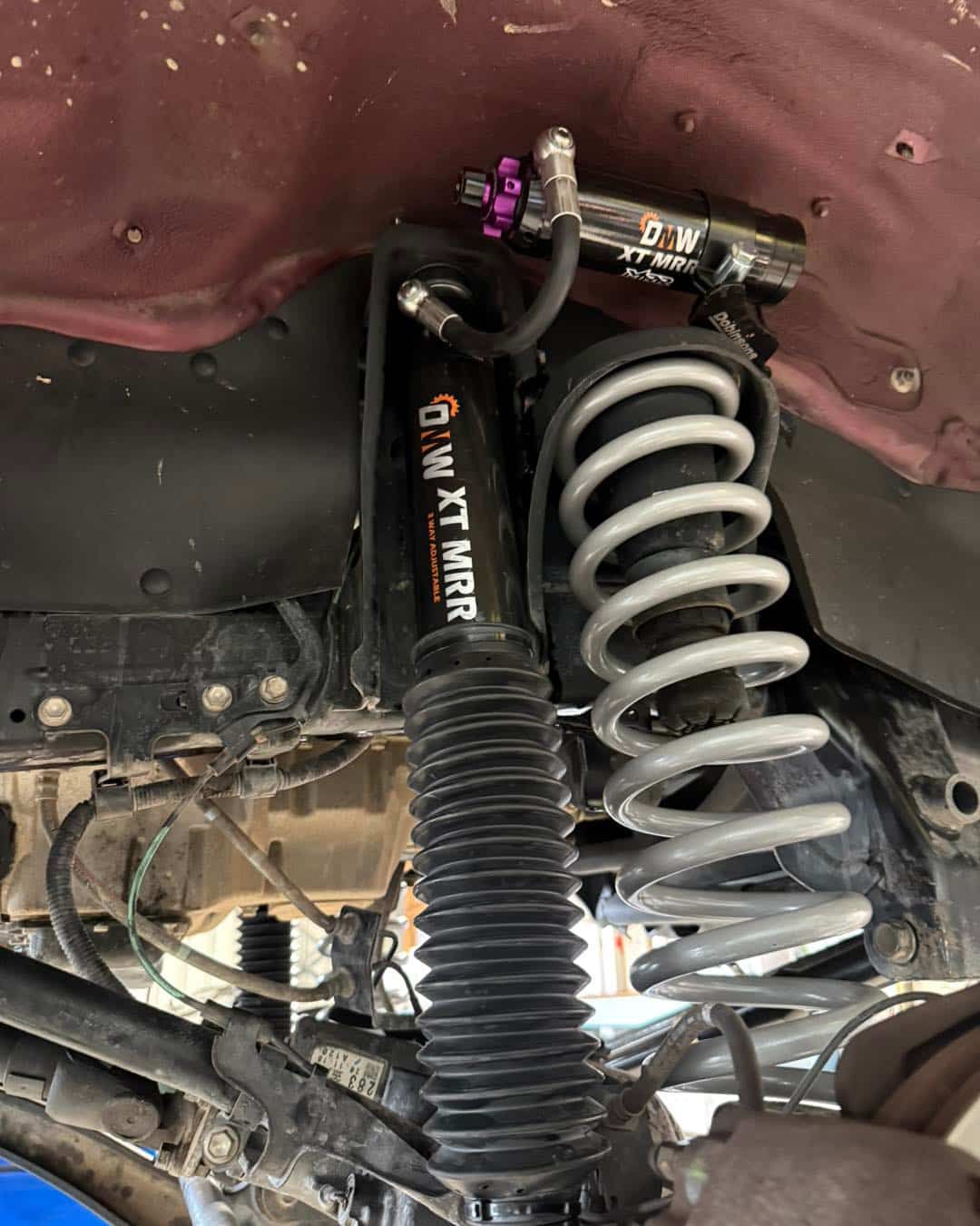 Black Suspension Shock Absorber With Silver Coil Spring Installed — Track N Back 4x4 In Atherton, QLD