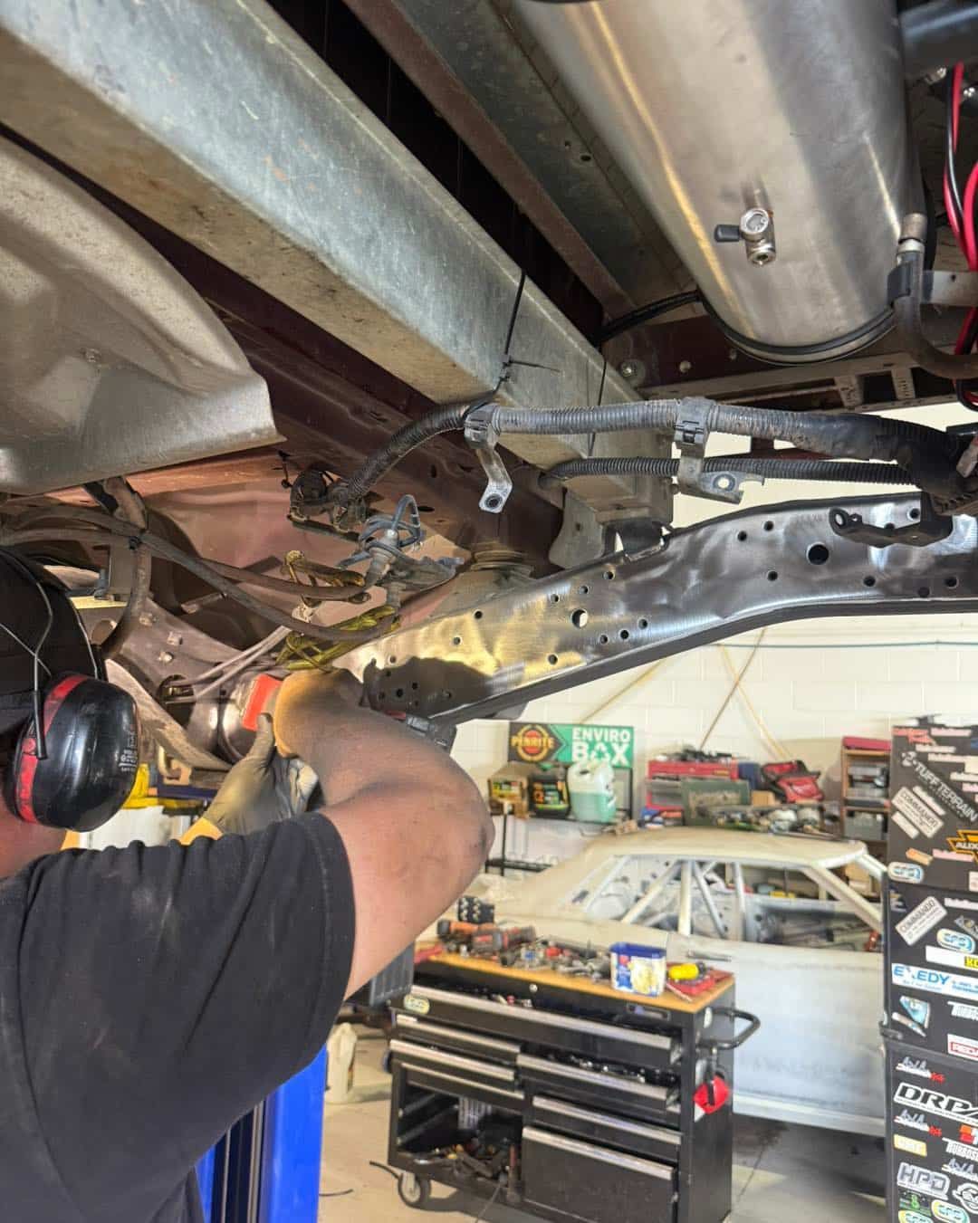 Mechanic Working on the Underside of a Vehicle — Track N Back 4x4 In Cairns, QLD