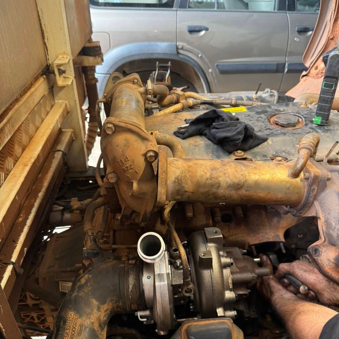 Black Toyota Truck With Open Hood on a Dynamometer in a Garage — Track N Back 4x4 In Mareeba, QLD