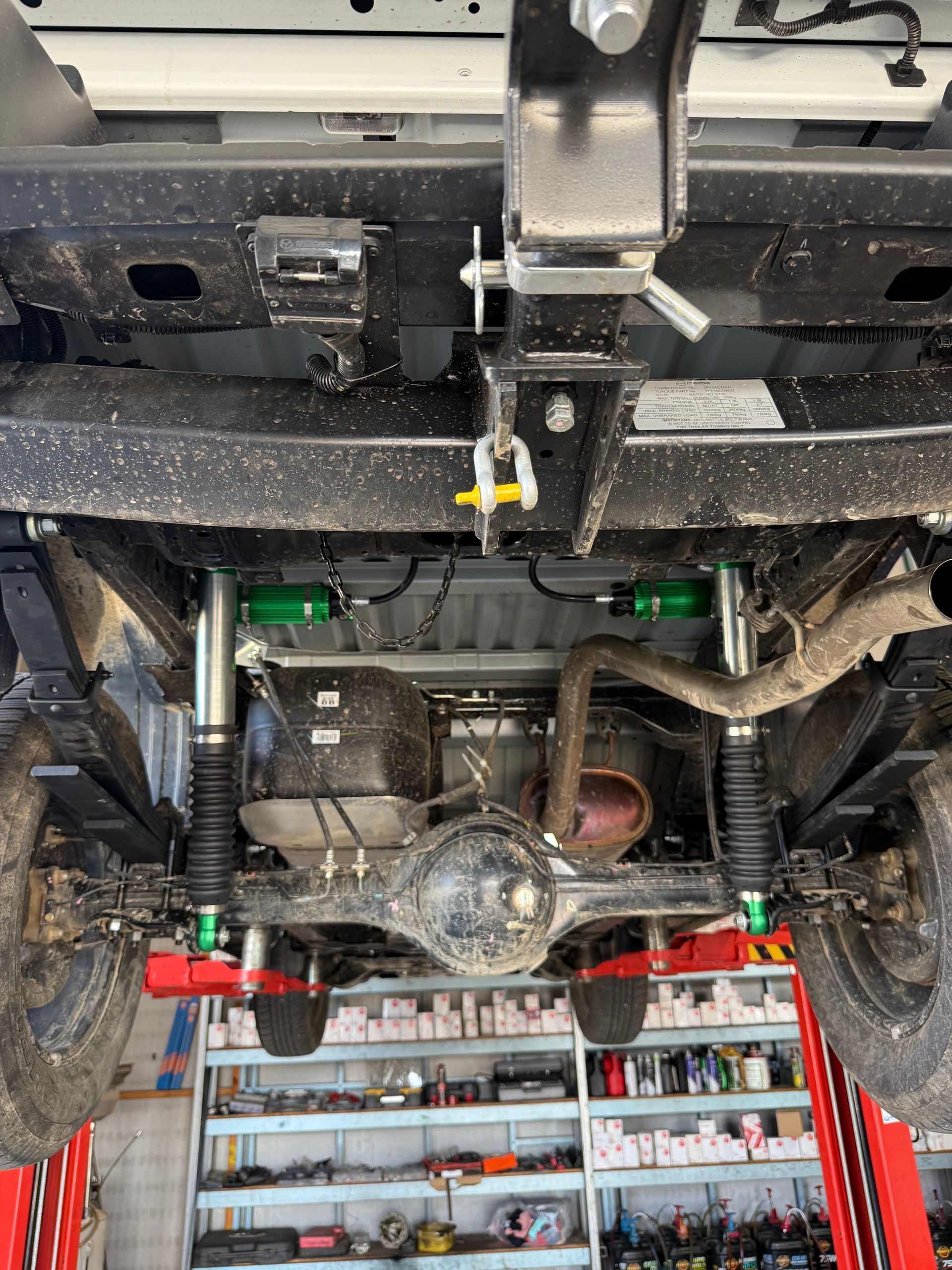 Undercarriage of a Vehicle Lifted on a Hoist — Track N Back 4x4 In Mareeba, QLD