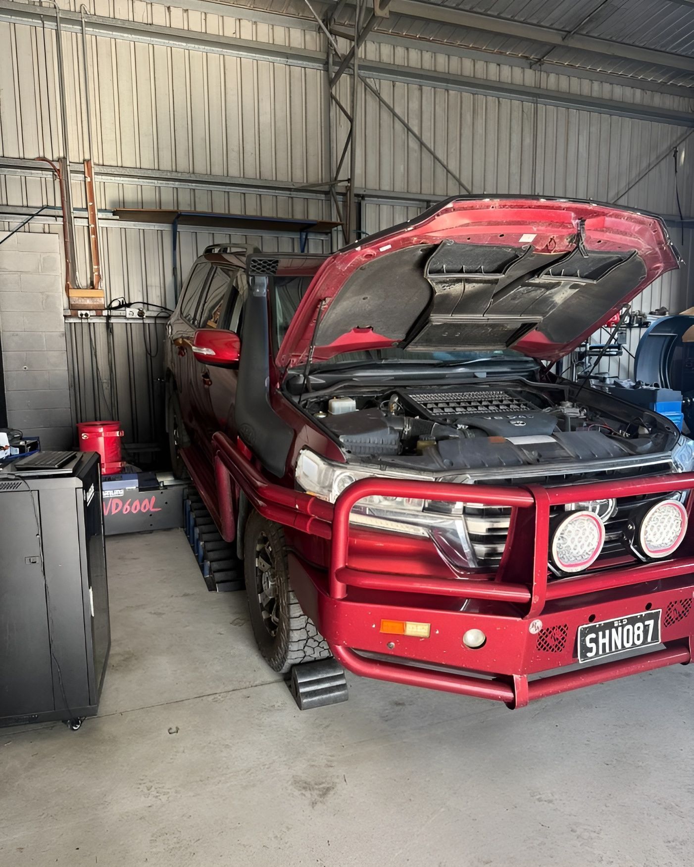 Close-up of a Gray Pickup Truck's Front Wheel and Tire — Track N Back 4x4 In Mareeba, QLD