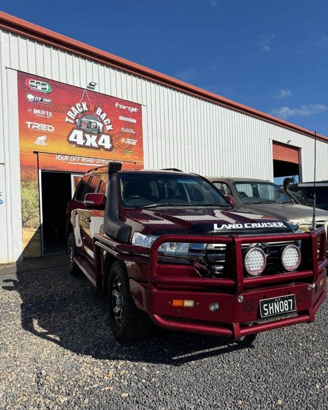 Mechanic Testing Fuses in a Car Engine With a Multimeter — Track N Back 4x4 In Weipa, QLD
