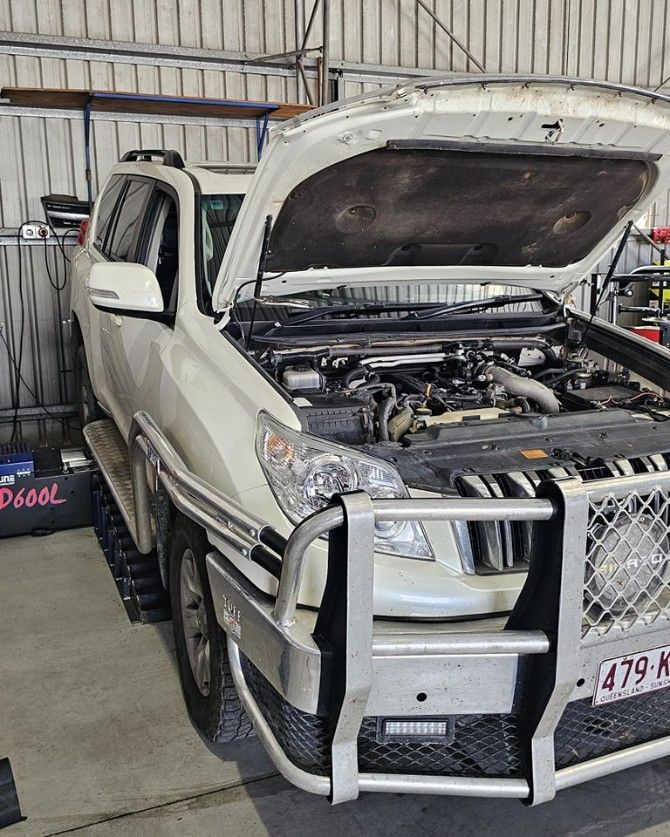 White Suv With Its Hood Open in a Garage, Showing the Engine — Track N Back 4x4 In Mareeba, QLD