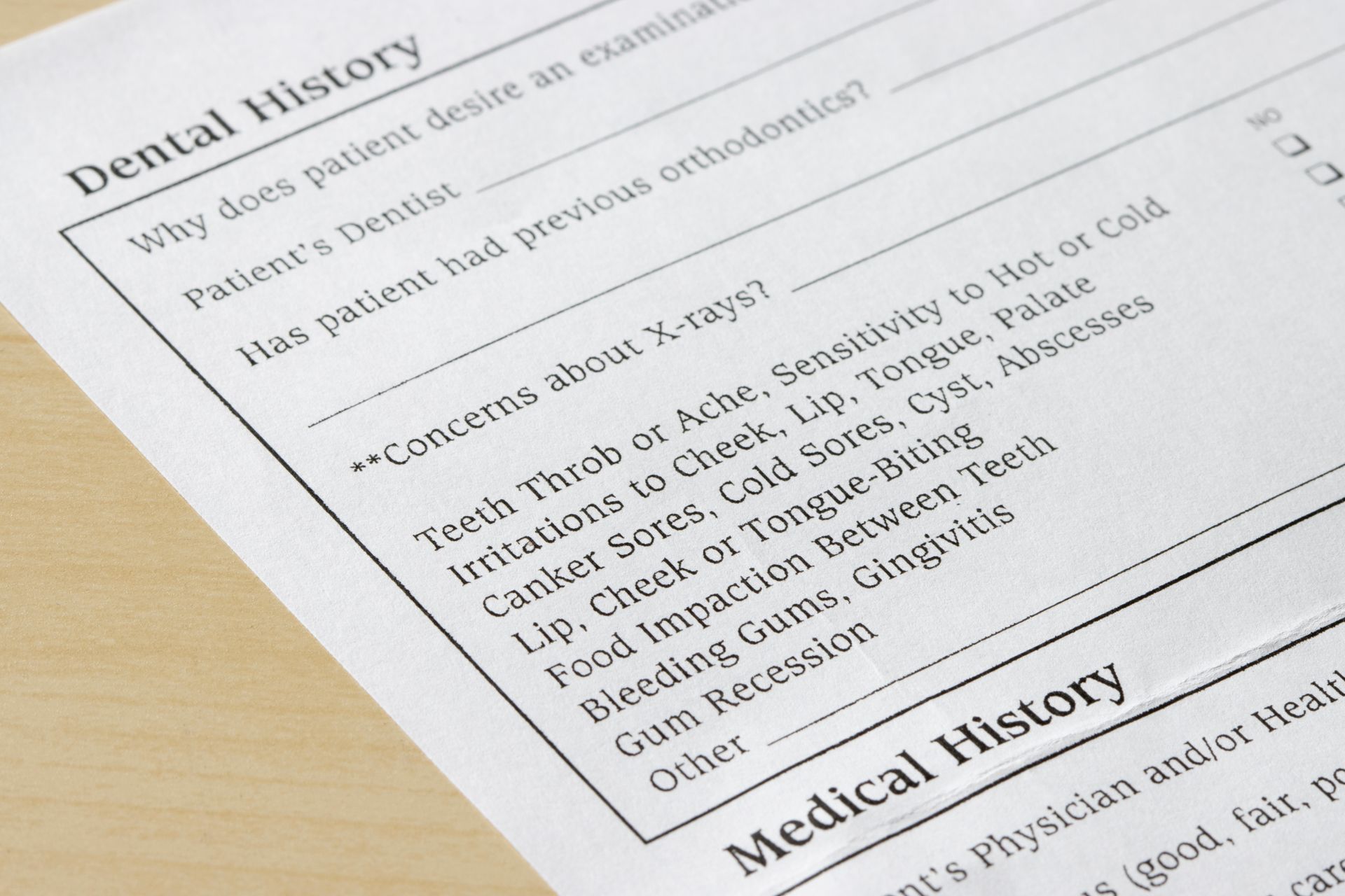 A close up of a dental history form