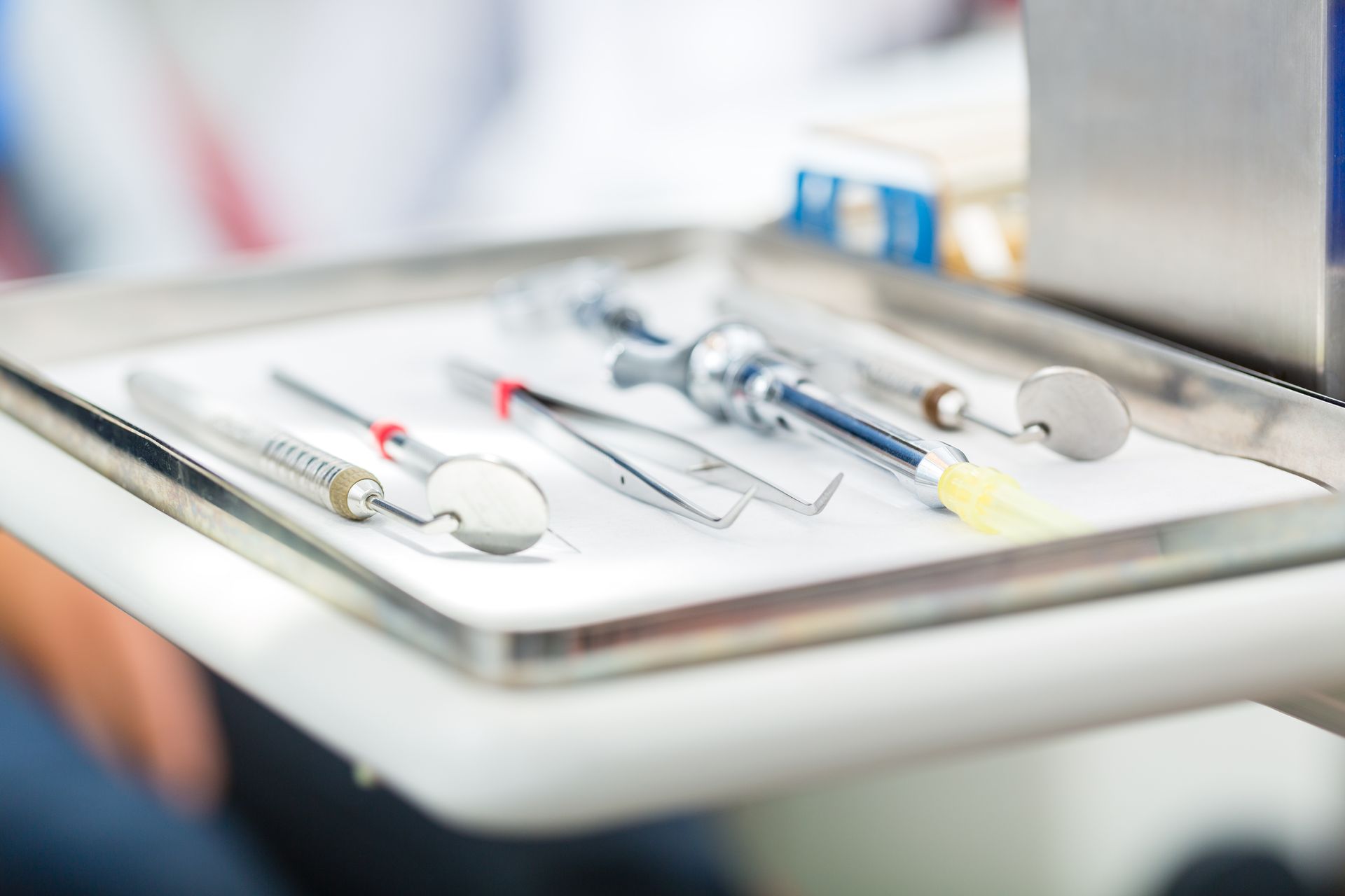 A tray of dental instruments is sitting on a table.