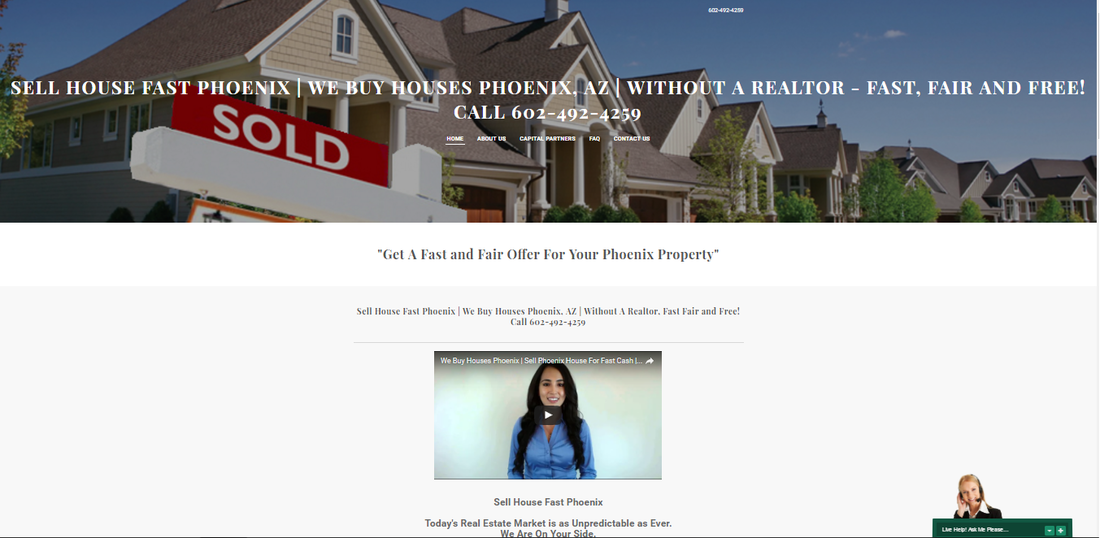 A woman is standing in front of a sold sign in front of a house.