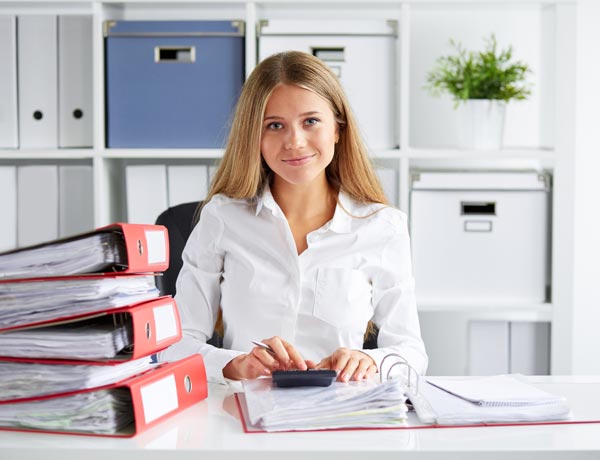 Business woman calculates tax — Murray, KY — Pierce Keller & Associates