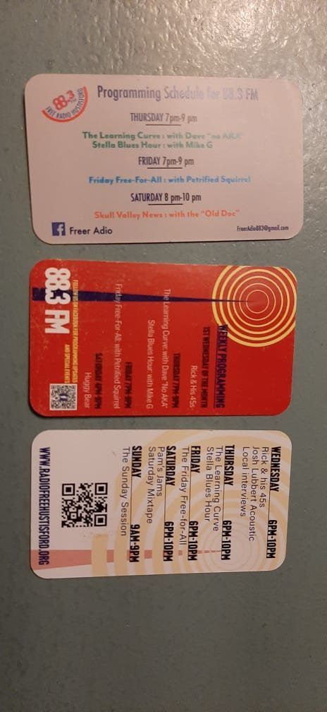 A couple of cards sitting on top of each other on a table.