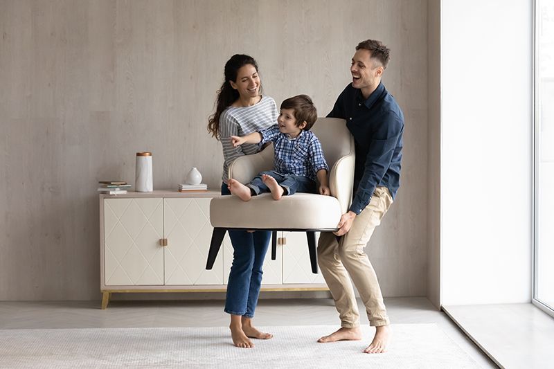 Happy Couple Playing With Their Son