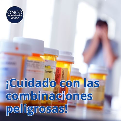 Botellas de medicamento con mujer desenfocada al fondo.