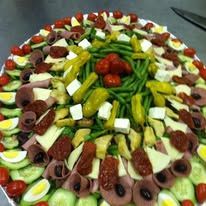 A large plate filled with lots of different types of food on a table.