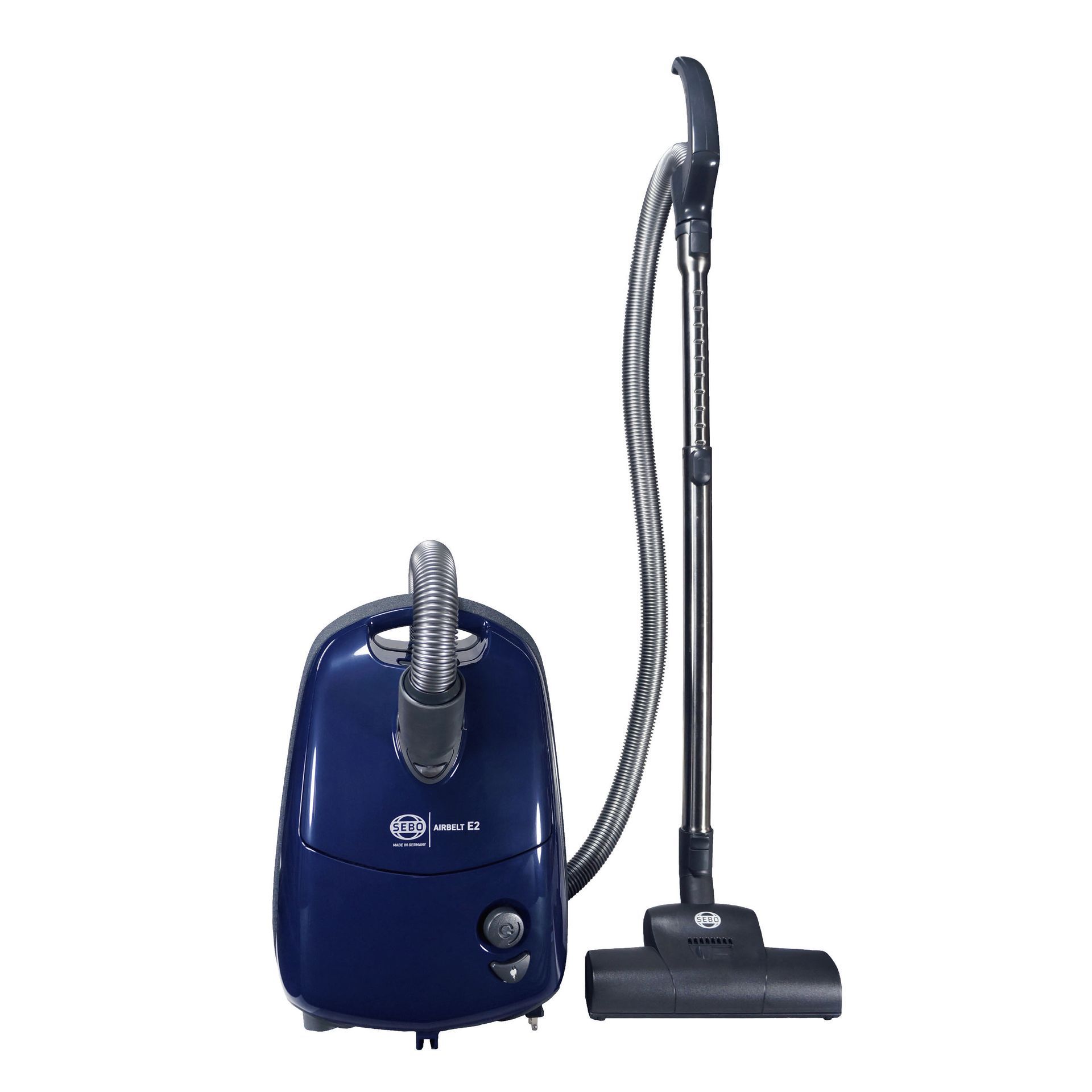 Blue canister vacuum with hose and floor attachment.