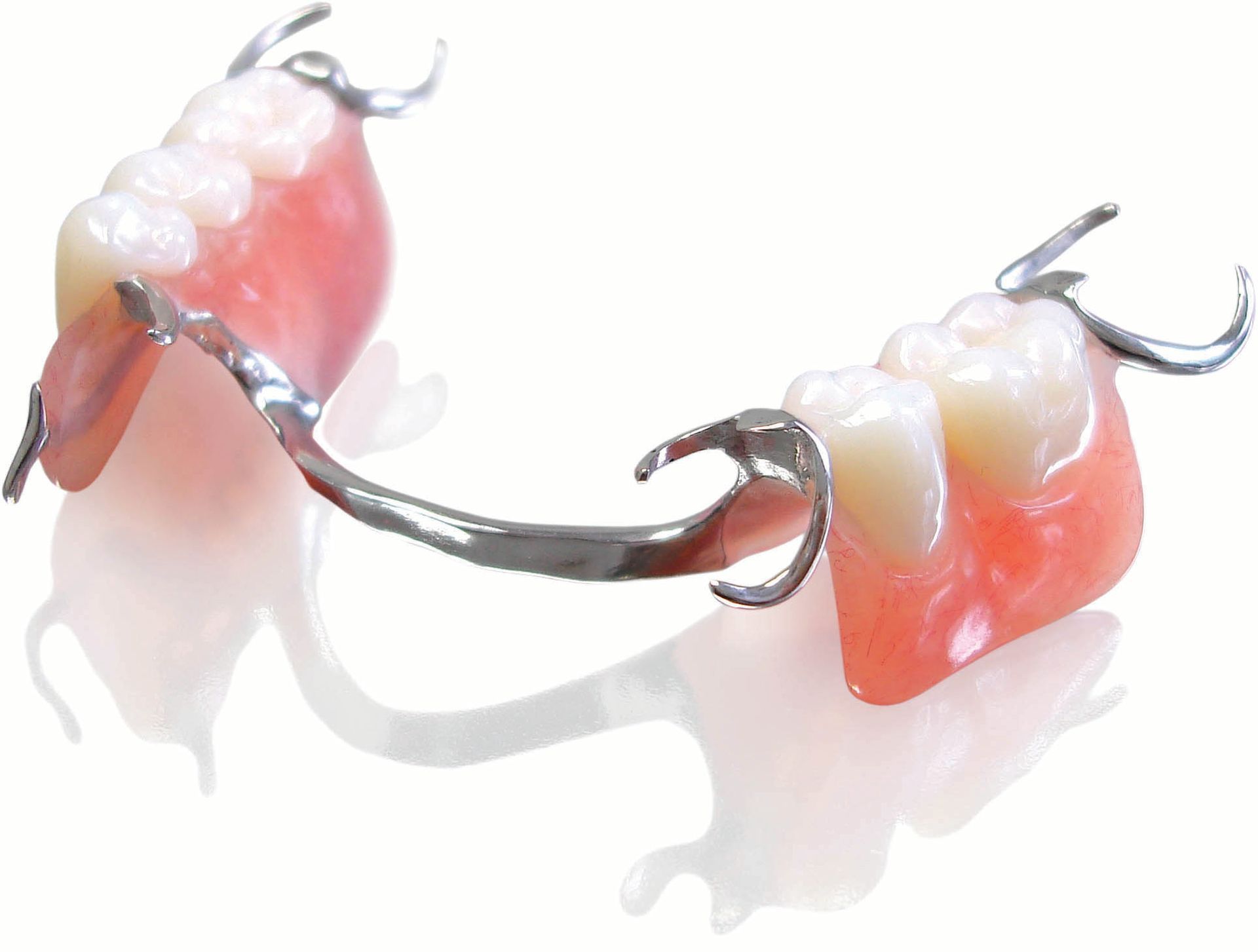 A Model of A Person 's Teeth Is Sitting on A Table — Cosmetic Denture Services–Jacob Maxwell in Proserpine, QLD