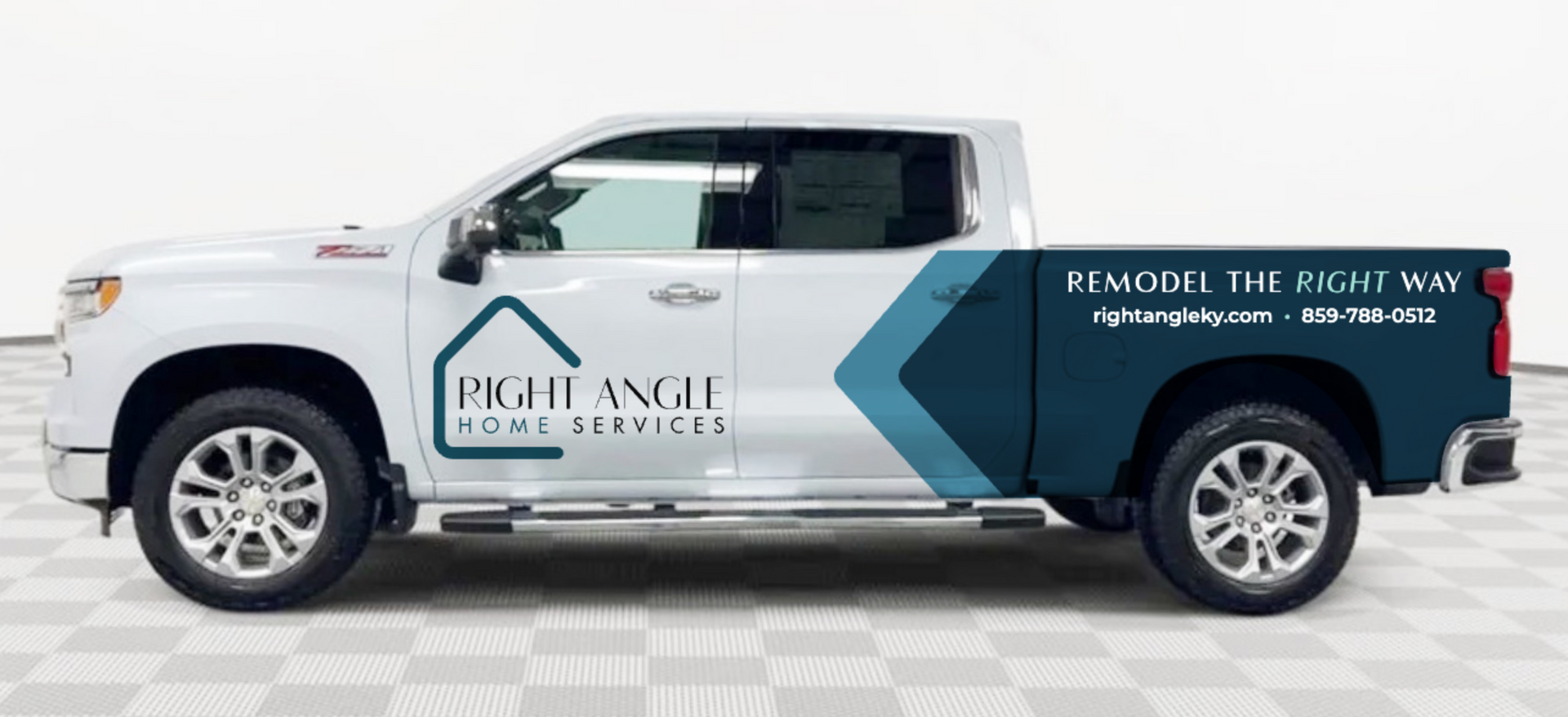 White pickup truck with Realville Service branding and blue text promoting remote truck tire service