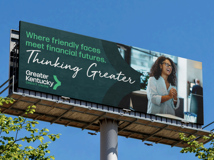 Billboard for Greater Kentucky with slogan “Where friendly faces meet financial futures” and a woman on the right