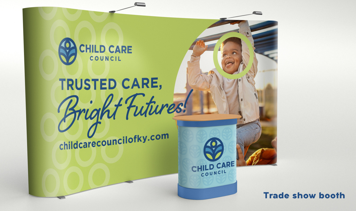 Trade show booth with Child Care Council branding, bright green backdrop, slogan, and display pedestal