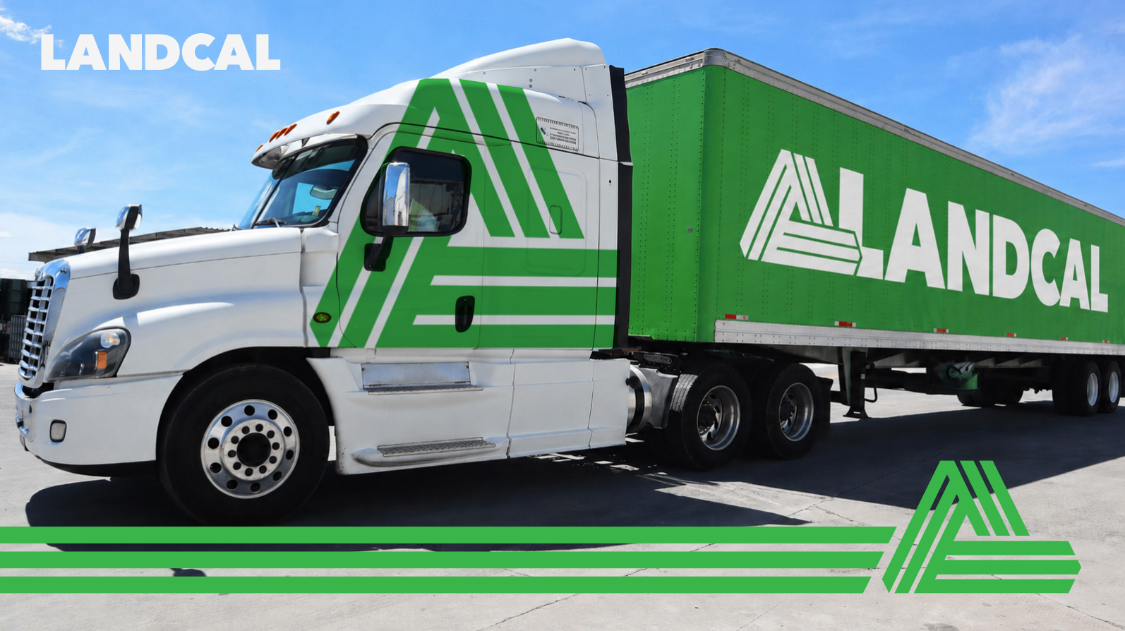 White and green LANDCAL semi-truck driving on a road under a blue sky