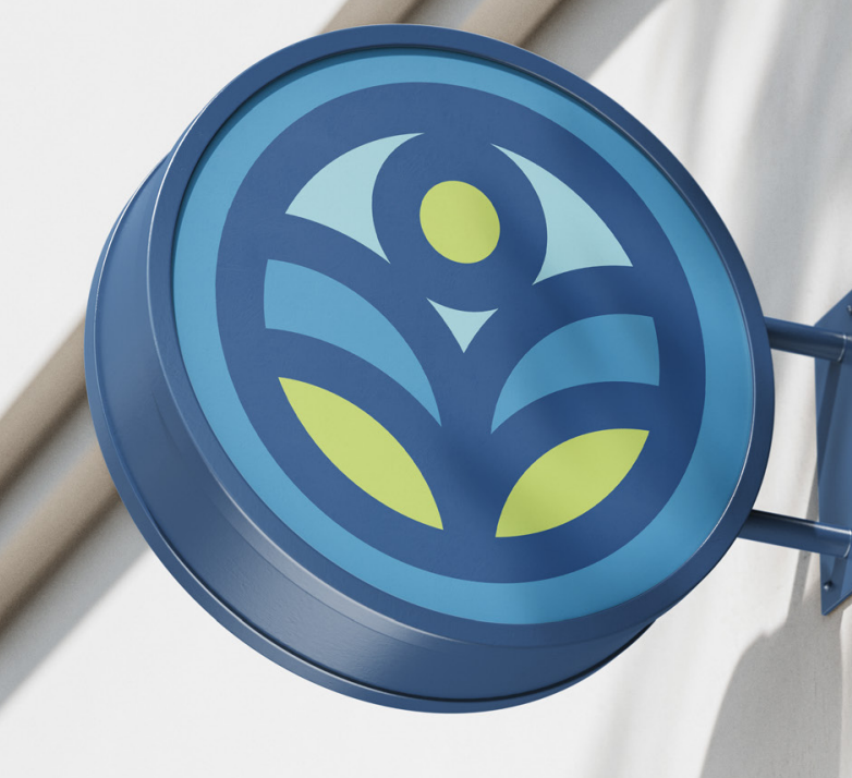 Blue circular sign with a stylized leaf and person icon in green and light blue