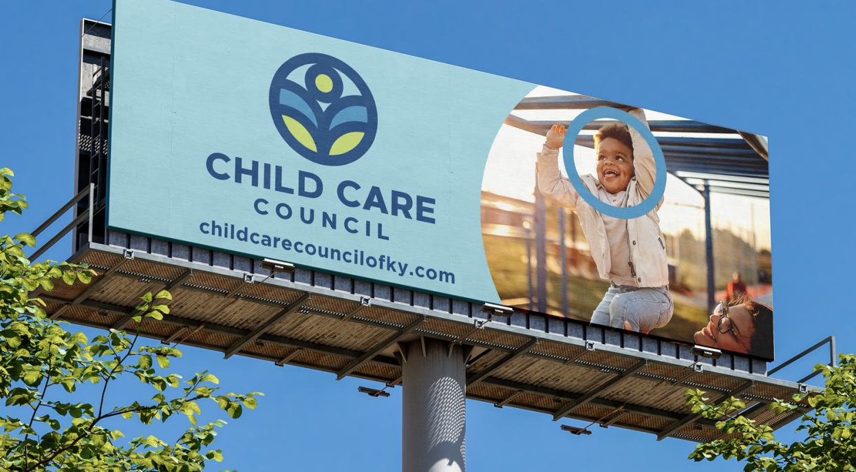 Billboard for Child Care Council with logo, website, and a child photo against a blue sky