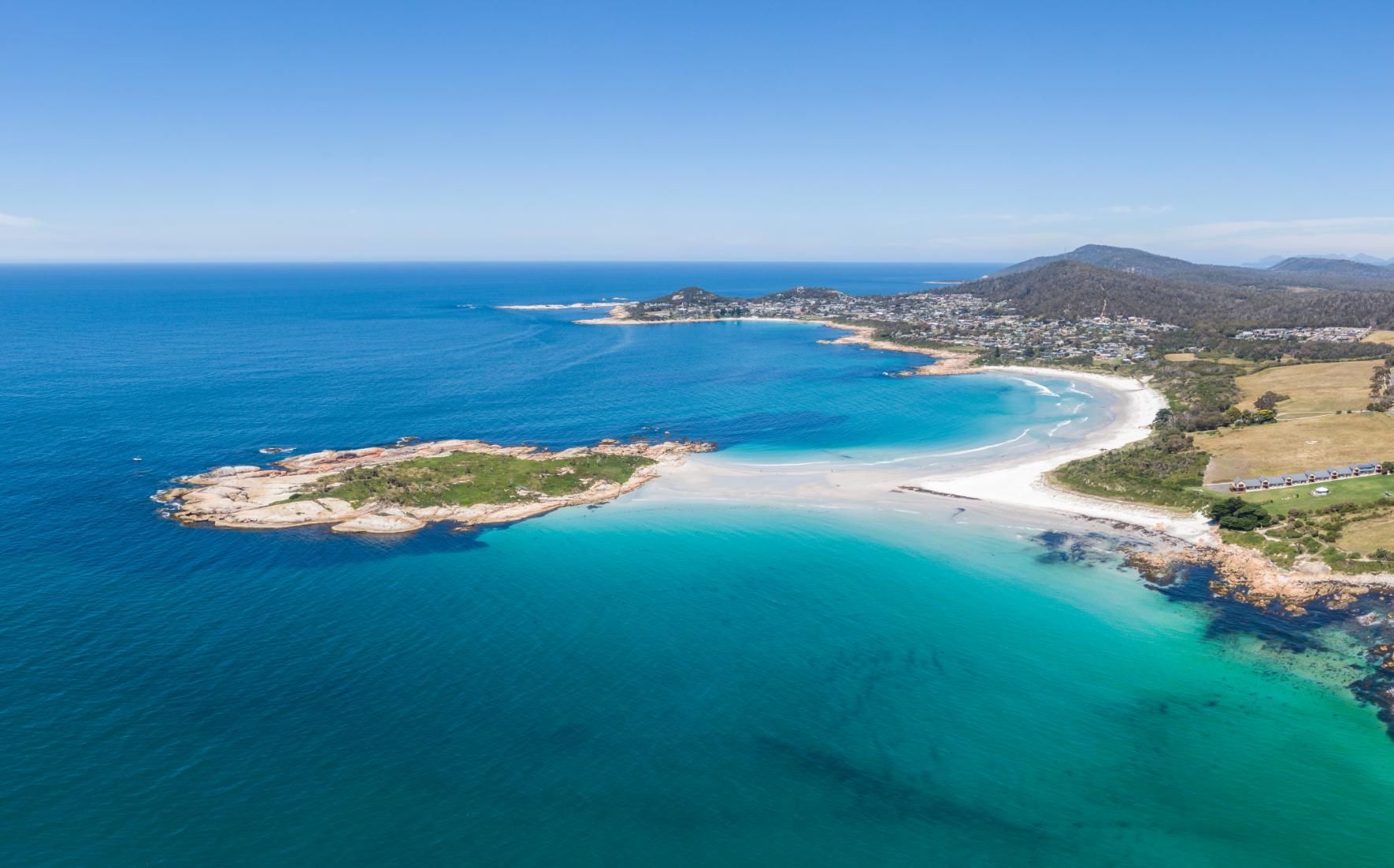 an Aerial View of a Small Island in the Middle of a Large Body of Water — Port Stephens Bathrooms In Shoal Bay, NSW