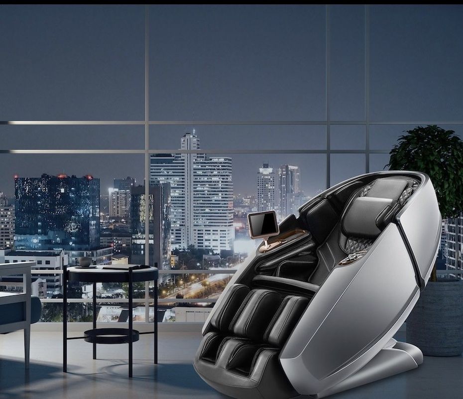 A massage chair is sitting in front of a window overlooking a city