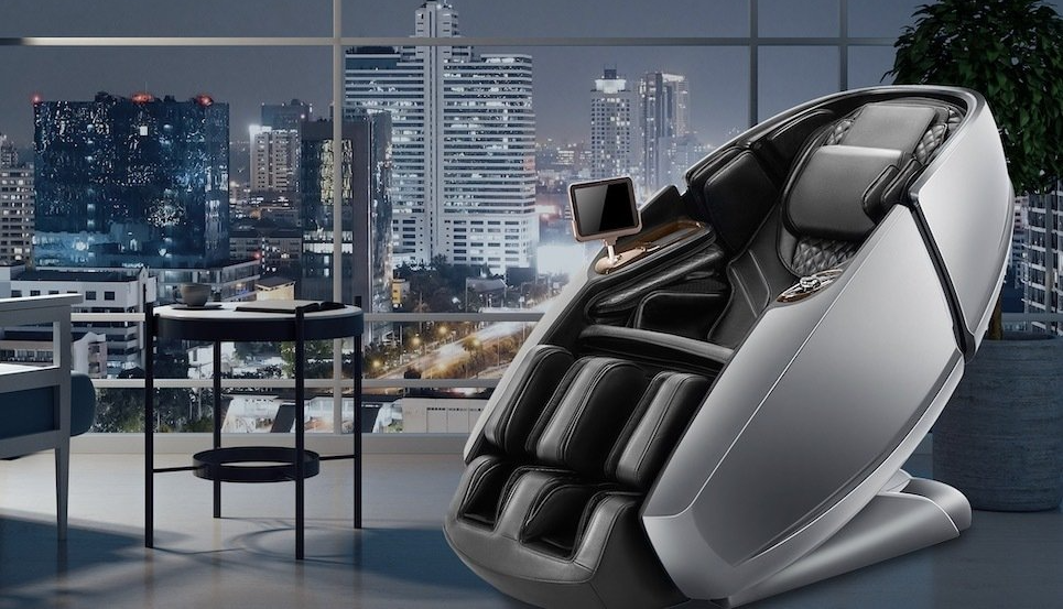 A massage chair is sitting in a room with a city in the background.